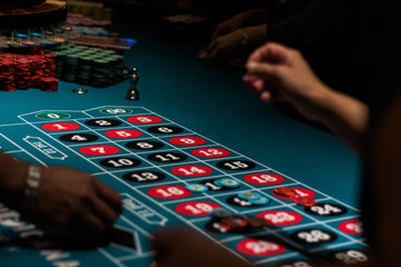 MRC Poker home poker tournament setup with poker chips, playing cards, and poker tables 